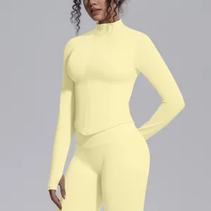 Women's slim fit seamless yellow yoga jacket with stand collar and front zipper detail