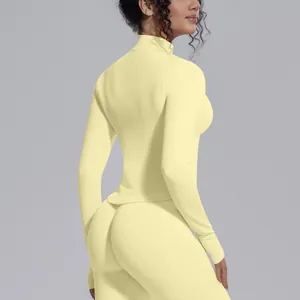 Rear view of yellow seamless high-stretch yoga top and leggings with mock neck.