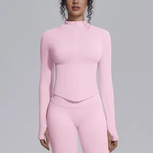 Detail view of pink stand collar yoga jacket with front zipper and thumbholes