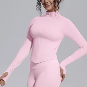 Detailed view of pink seamless sports jacket with zipper stand collar and thumb holes
