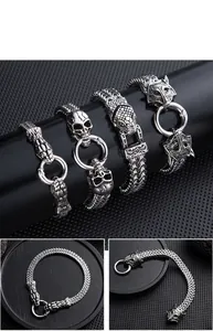 Detailed view of vintage punk stainless steel bracelets with snake and skull motifs.
