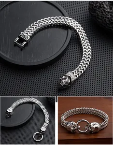 Detail view of retro punk stainless steel bracelets with snake and skull head designs