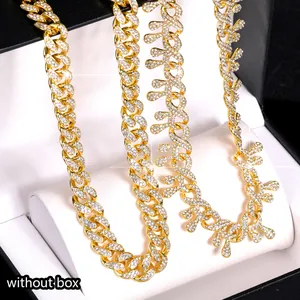 Detail of iced out thorn dripping necklace and gold Cuban chains in hip-hop style