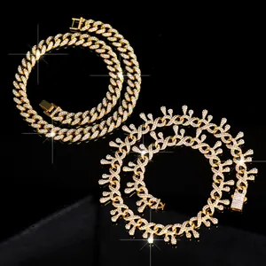 Detailed view of iced-out gold Cuban link and thorn style hip-hop necklaces.