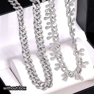 Close-up of iced out thorn Cuban link chain necklace with sparkling rhinestones silver