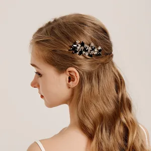 Elegant vintage bridal hair comb with black stones and rhinestones for wedding hairstyles.