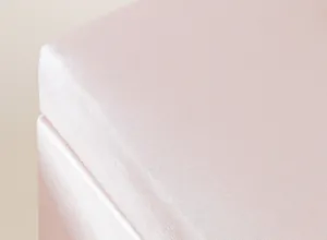Macro detail of pink shimmering fabric on luxury jewelry storage box