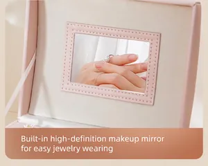 Close-up of elegant pink jewelry box lid featuring a built-in high-definition mirror