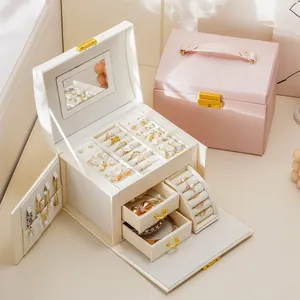 Elegant three-layer faux leather jewelry storage box with drawers, mirror and lock