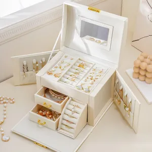 Multifunctional 3-layer cream white jewelry storage box with drawers and mirror.