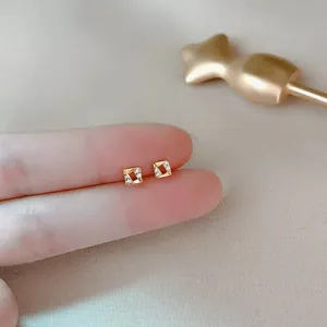 Minimalist geometric square gold stud earrings with sparkling cubic zirconia accents