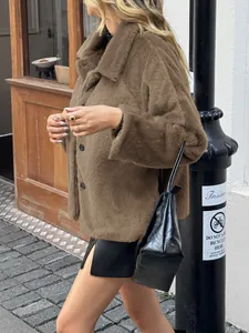 Detailed side view of a brown faux fur coat with large buttons and plush texture