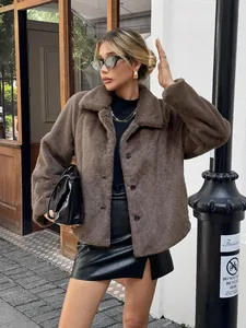 Full-body view of a stylish brown faux fur coat paired with a black leather skirt.