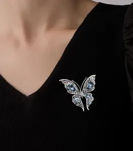 Exquisite crystal butterfly brooch pinned on a black garment showing detailed craftsmanship