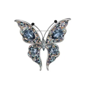Elegant silver-tone crystal butterfly brooch with deep blue teardrop stones for women