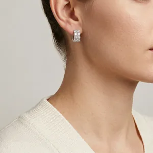Elegant 925 sterling silver moissanite hoop earrings shown in a model wearing shot