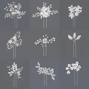 Detailed macro view of nine various bridal hair pins with pearls and crystal rhinestones