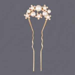 Elegant gold U-shaped bridal hair fork with clustered white faux pearls for wedding
