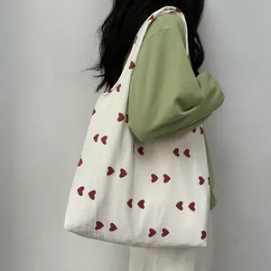 Large capacity off-white canvas tote bag with small red heart embroidery pattern