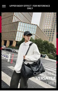 Large vintage PU leather travel bag with shoe compartment shown on model in urban street