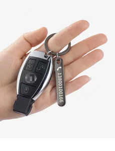 Close-up of personalized stainless steel anti-lost keychain tag with custom engraved number.