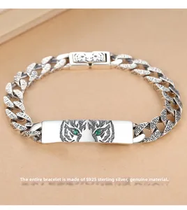 Detailed view of S925 sterling silver tiger totem bracelet featuring green stone eyes