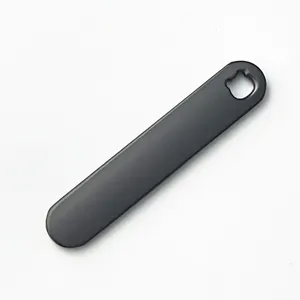 Detailed macro view of matte gunmetal gray zinc alloy blank keychain for engraving.
