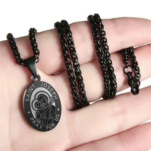 Detailed view of Saint Joseph black stainless steel pendant necklace with pray for us engraving