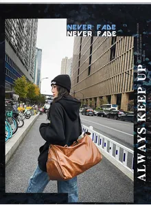 Large brown PU leather travel bag with shoe compartment shown in a city street setting