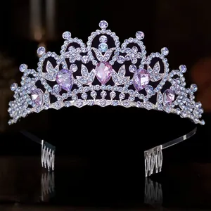 Elegant silver-toned bridal tiara crown featuring lavender crystal rhinestones for weddings.