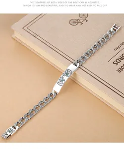 Detailed macro view of silver tiger totem bracelet featuring intricate Tang grass pattern