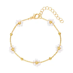 Elegant Korean style gold chain bracelet featuring delicate white pearl flower charms