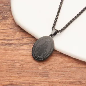 Detailed macro view of black stainless steel Miraculous Medal pendant necklace