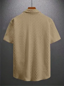 Men's short-sleeve textured knit polo shirt with stylish geometric patterns.
