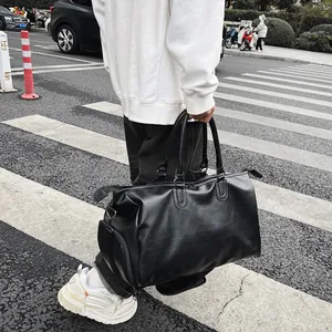 Black waterproof PU leather travel duffel bag with shoe compartment for business trips