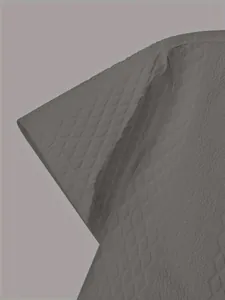 Detailed macro shot of the grey knit shirt sleeve showing diamond jacquard texture