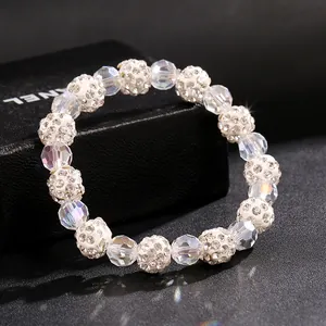 Close-up of sparkling crystal and rhinestone shamballa beads on an elastic bracelet