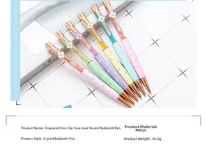Close-up detail of colorful crystal ballpoint pens with four-leaf clover clips and metal body