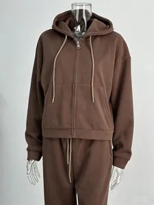 Casual brown oversized zip-up hoodie and matching sweatpants set on clear mannequin