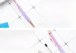 Detail of purple clover crystal ballpoint pen showing sparkling crystals and barrel