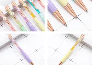 Detail shot of elegant sparkling clover crystal ballpoint pens in rose gold finish