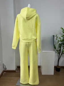 Back view of yellow two-piece hoodie and wide-leg pants loungewear set for women