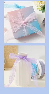 Detail view of pink and purple hollow lace ribbons used for gift wrapping and vase decoration.