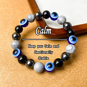 Close-up of an evil eye beaded bracelet with hematite and howlite for calm energy.