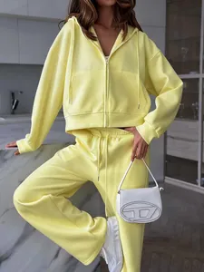 Women's stylish yellow oversized hooded tracksuit set featuring a zip-up hoodie jacket