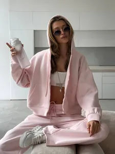 Stylish pink oversized hoodie and jogger tracksuit set for women in casual street style