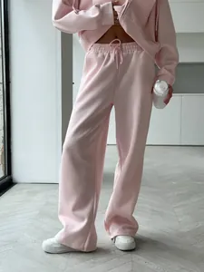 Detailed view of pink oversized hoodie and matching lounge sweatpants set