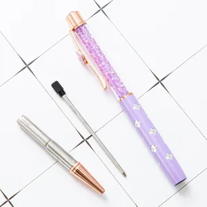 Elegant purple crystal ballpoint pen set featuring clover patterns and a refill.