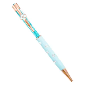 Elegant light blue crystal ballpoint pen with rose gold four-leaf clover accents