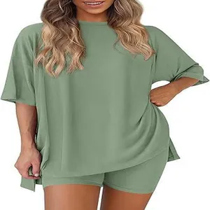 Detail view of women's sage green casual loose loungewear set with side slit top